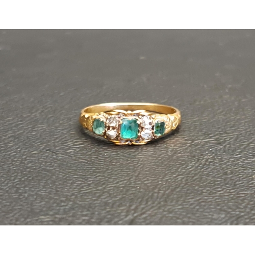 VICTORIAN EMERALD AND DIAMOND RING
the central emerald approximately 0.15cts, in unmarked high carat gold, ring size K-L and approximately 1.5 grams