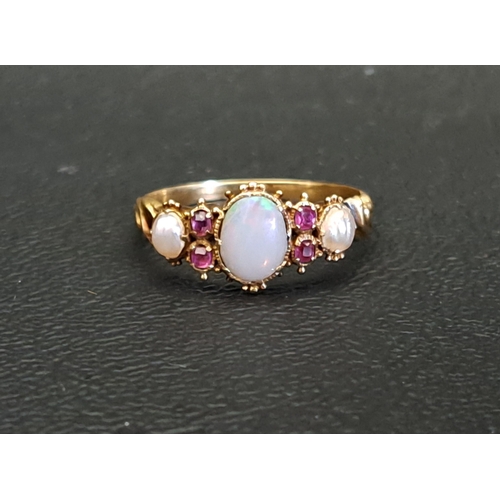VICTORIAN OPAL, RUBY AND SEED PEARL RING
the central opal measuring 6mm x 5mm, in unmarked high carat gold (tests as 18 carat), ring size N-O and approximately 1.9 grams