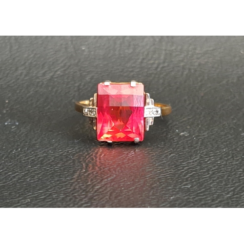 53 - RED GEM AND DIAMOND SET RING
the central checkerboard cut gemstone possibly ruby and measuring 10mm ... 