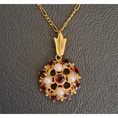 66 - GARNET AND SEED PEARL CLUSTER PENDANT 
in nine carat gold and on nine carat gold chain, the pendant ... 