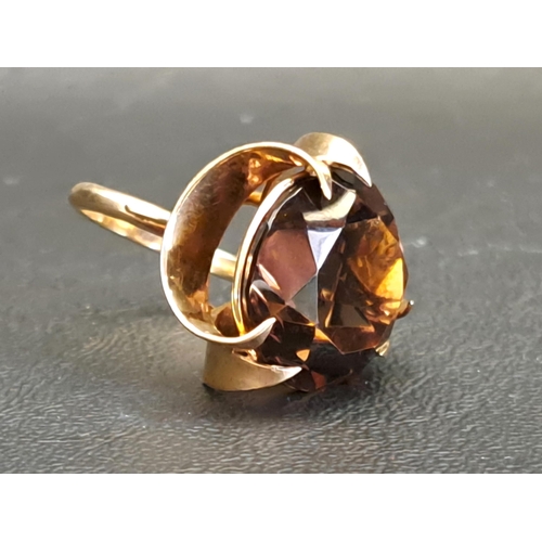 136 - LARGE SMOKY QUARTZ SINGLE STONE DRESS RING
the round cut quartz measuring approximately 17.5mm x 17.... 