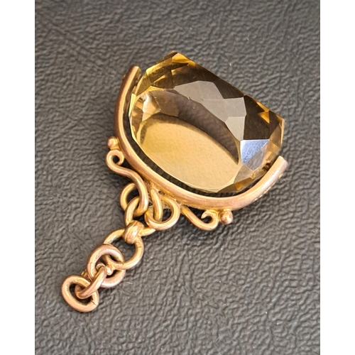 CITRINE SWIVEL FOB
in nine carat gold mount, the gemstone approximately 2.4cm wide