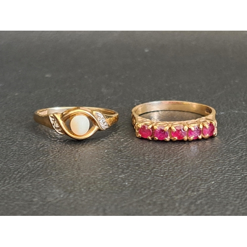 TWO NINE CARAT GOLD RINGS
one a ruby five stone ring, ring size O and approximately 2.2 grams; and another set with opal, ring size L-M and approximately 1.6 grams