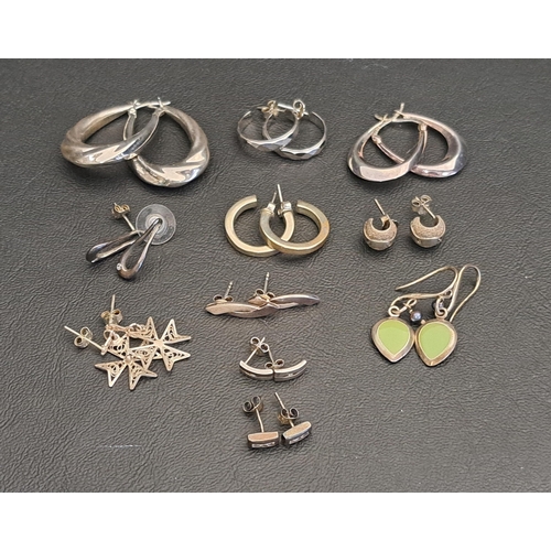 ELEVEN PAIRS OF SILVER EARRINGS
including five pairs of hoop earrings, a pair of enamel drop earrings, a pair of small diamond set stud earrings, etc.