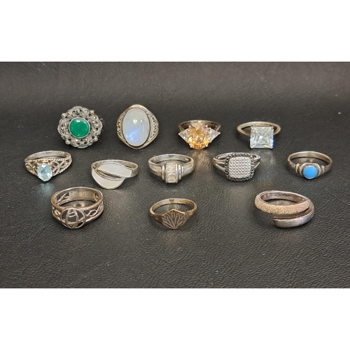 SELECTION OF TWELVE SILVER RINGS
including a blue topaz single stone ring, turquoise, marcasite and other stone set examples, etc.