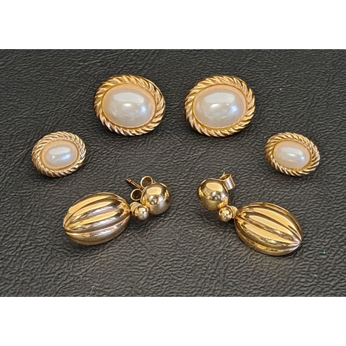 THREE PAIRS OF NINE CARAT GOLD EARRINGS
comprising one pair with ribbed oval drops, approximately 2.5 grams; and two pairs of simulated pearl set stud earrings of graduated size, total weight of both pairs approximately 2.1 grams