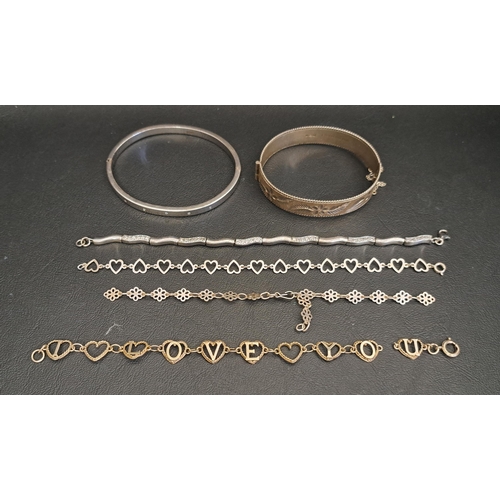 TWO SILVER BANGLES AND FOUR SILVER BRACELETS
one bangle with engraved foliate decoration and the other set with small flush set diamonds, two of the bracelets with heart links and another set with CZ