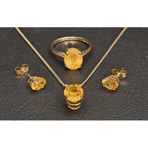 82 - CITRINE SUITE OF JEWELLERY
comprising a single stone ring on nine carat gold shank, the oval cut cit... 