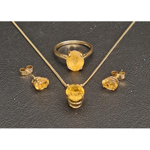 82 - CITRINE SUITE OF JEWELLERY
comprising a single stone ring on nine carat gold shank, the oval cut cit... 