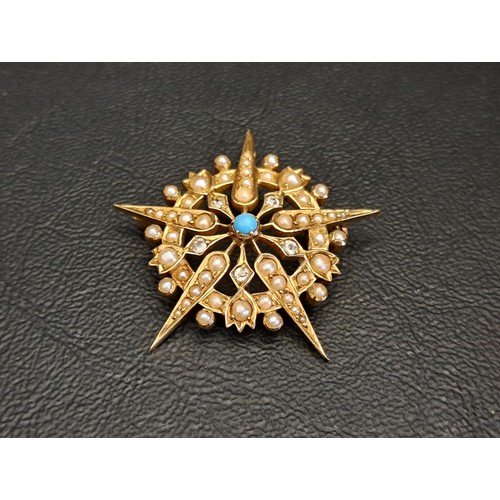 VICTORIAN/EDWARDIAN SEED PEARL AND TURQUOISE STARBURST PENDANT
in fifteen carat gold, 3.9cm high and approximately 7.6 grams