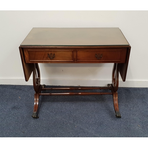 MAHOGANY SOFA TABLE
with two frieze drawers and two opposing dummy drawers, standing on lyre end supports with reeded legs and brass lion paw feet, 73cm x 151cm x 50cm