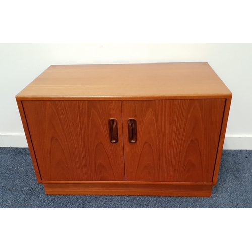 TEAK LOW SIDE CABINET
with a pair of doors opening to reveal a shelf, standing on a plinth base, 53.5cm x 81cm x 46cm