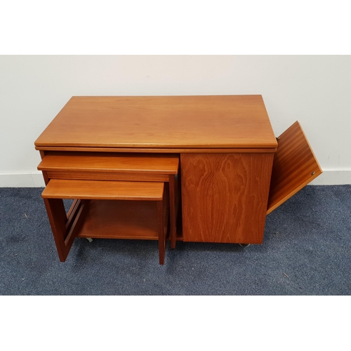MCINTOSH TEAK SIDE TABLE
with a rotating fold over top above a nest of two tables and a side fold down cupboard door, on casters, 55.5cm x 88cm x 49cm