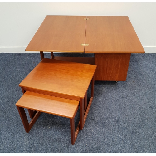 437 - MCINTOSH TEAK SIDE TABLE
with a rotating fold over top above a nest of two tables and a side fold do... 