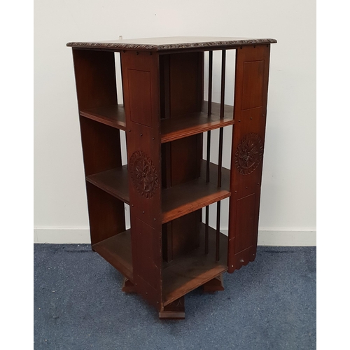 LARGE REVOLVING WALNUT BOOKCASE
with a configuration of three tiers, on a carved platform with casters, 107.5cm high