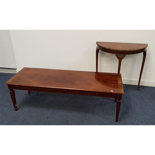 G PLAN MAHOGANY AND CROSSBANDED OCCASIONAL TABLE
with a rectangular top above a carved frieze, standing on tapering supports, 43.5cm x 138cm x 48cm, together with a demi lune mahogany side table with a wavy edge, standing on slender tapering supports with pad feet, 72.5cm x 73cm x 37.5cm