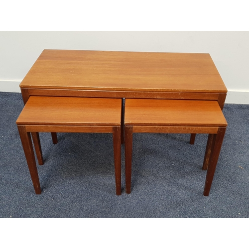 TEAK NEST OF OCCASIONAL TABLES
with a rectangular top and standing on tapering supports, with two square top tables below, 45.5cm x 84cm x 38cm