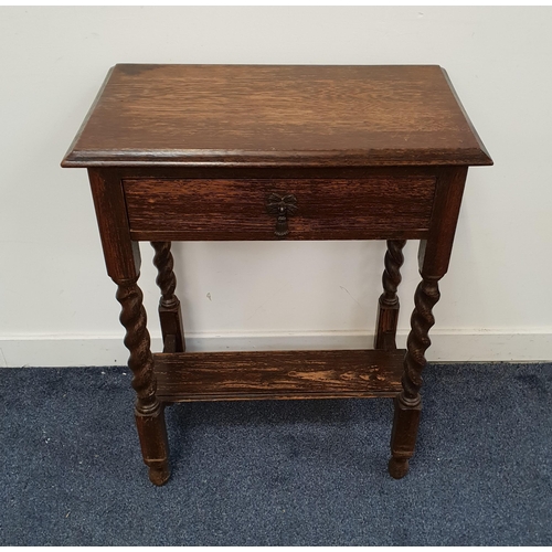 OAK SIDE TABLE
with a moulded top above a single frieze drawer, standing on barley twist supports united by an undertier, 76cm x 60cm x 35.5cm