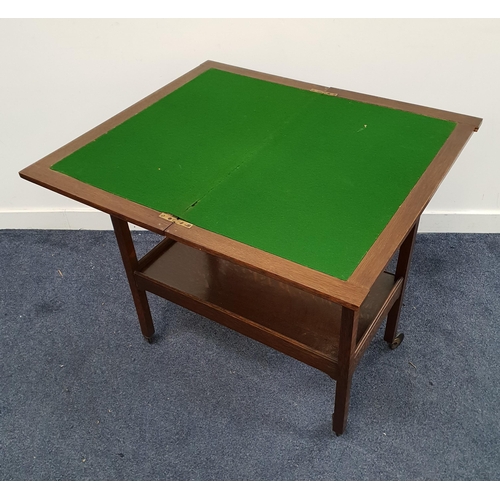 469 - OAK COMBINATION TROLLY
with a fold over baize lined rotating top, on plain supports with casters uni... 