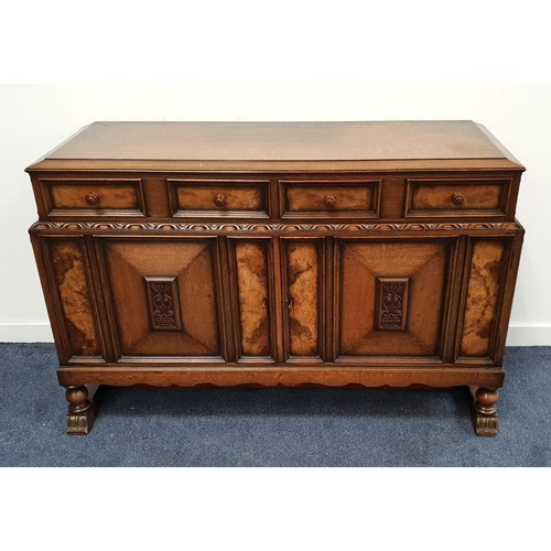 OAK AND WALNUT SIDEBOARD
with two panelled frieze drawers above two panelled cupboard doors, standing on stout plank supports, 89cm x 137cm x 49cm