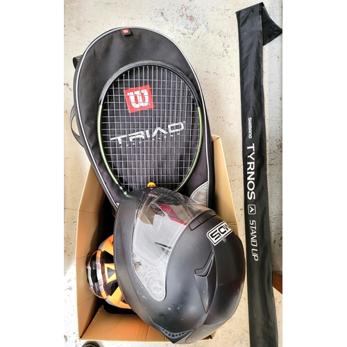 ONE BOX OF SPORTING AND LEISURE ITEMS
including a Tyrnos fishing rod, Blade tennis racket, football, ski goggles, a motorbike and a bike helmet, and a harmonica