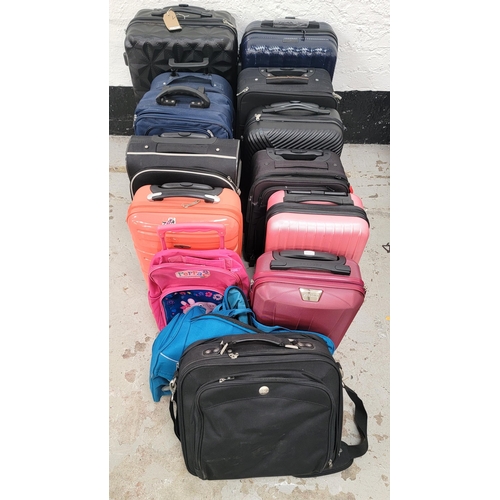 42 - SELECTION OF ELEVEN SUITCASES AND THREE BAGS
including Navigator, Puccini, Slazenger, and Spilbergen... 