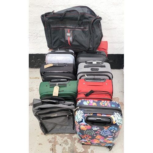 SELECTION OF NINE SUITCASES AND TWO BAGS
including Skyflite, Eliox, IT Luggage, and Saxoline
Note: all cases and bags are empty