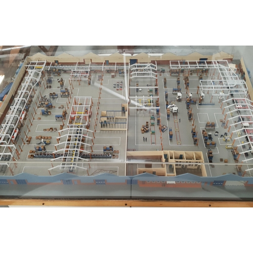 SCALE MODEL OF A VOLVO LORRY FACTORY
showing the production line from start to finish, professionally made by Angus model makers of Glasgow, under a perspex case, 29cm x 150cm x 106cm