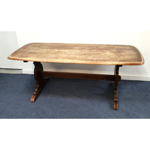 ERCOL ELM REFECTORY STYLE DINING TABLE
standing on shaped end supports united by a stretcher, 72.5cm x 183.5cm x 82cm