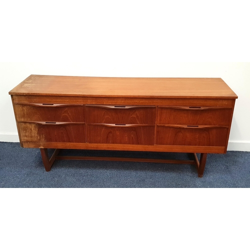 VINTAGE SAKOL TEAK SIDEBOARD
with a rectangular top above three pairs of drawers with roll over pierced handles, standing on continuous supports united by a stretcher, 69.5cm x 151.5cm x 40.5cm