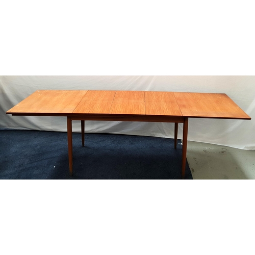 VINTAGE TEAK EXTENDINING TABLE
with a pull apart top revealing three fold out leaves, standing on turned tapering supports, 73cm x 249cm x 83cm