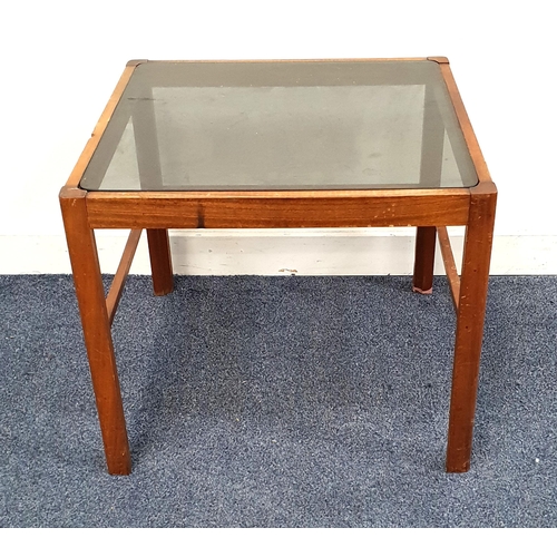 VINTAGE TEAK OCCASIONAL TABLE
with an inset smoked glass top, standing on shaped supports, 46cm x 55cm x 55cm