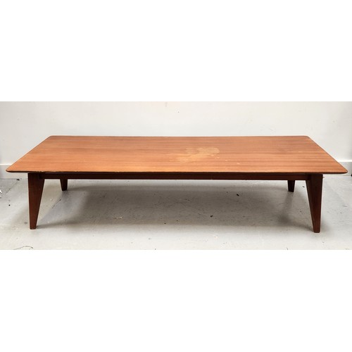 VANSON TEAK OCCASIONAL TABLE
with a rectangular top standing on tapering supports, 31cm x 138cm x 46.5cm