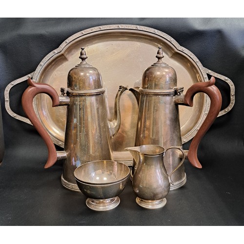 IMPRESSIVE SILVER COFFEE SET
comprising coffee pot and hot water jug, both of conical form with domed hinged covers and wood effect handles, sugar bowl, cream jug, and two handled tray with motif decorated rim and handles, all Birmingham hallmarks for 1966, maker J B Chatterley & Sons, total weight approximately 2615g/92.2oz