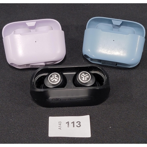 THREE PAIRS OF JLAB EARBUDS 
in charging cases