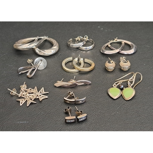 86 - ELEVEN PAIRS OF SILVER EARRINGS
including five pairs of hoop earrings, a pair of enamel drop earring... 