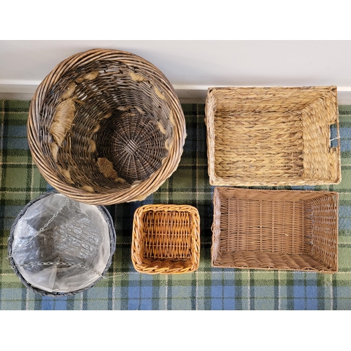 232 - SELECTION OF WICKER BASKETS
comprising a log basket, three storage baskets and two grey plant hangin... 