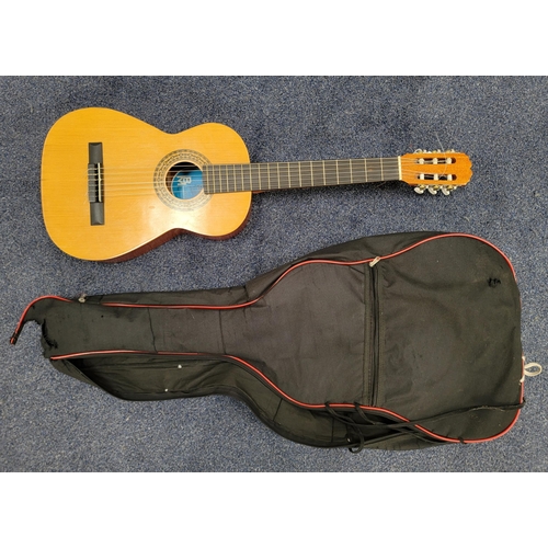 328 - SPANISH BM CLASICO ACCOUSTIC GUITAR
with a soft shell case