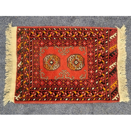 447 - TORKAMAN PRAYER RUG
with a red ground and banded border, 83cm x 56cm