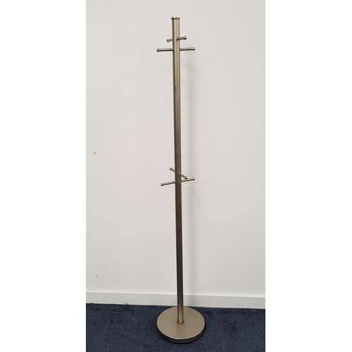 474 - BRUSHED STEEL COAT STAND
raised on a circular base with a turned column with eight hooks, 183cm high