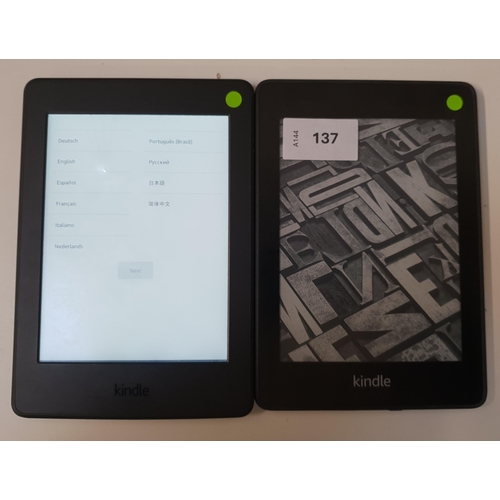 TWO AMAZON KINDLE E-READERS 
comprising a Paperwhite 4, serial number G000 PP13 0437 0WTB; and a Paperwhite 3, serial number G090 G105 7505 0167 (2)
Note: It is the buyer's responsibility to make all necessary checks prior to bidding to establish if the device is blacklisted/ blocked/ reported lost. Any checks made by Mulberry Bank Auctions will be detailed in the description. Please Note - No refunds will be given if a unit is sold and is subsequently discovered to be blacklisted or blocked etc.