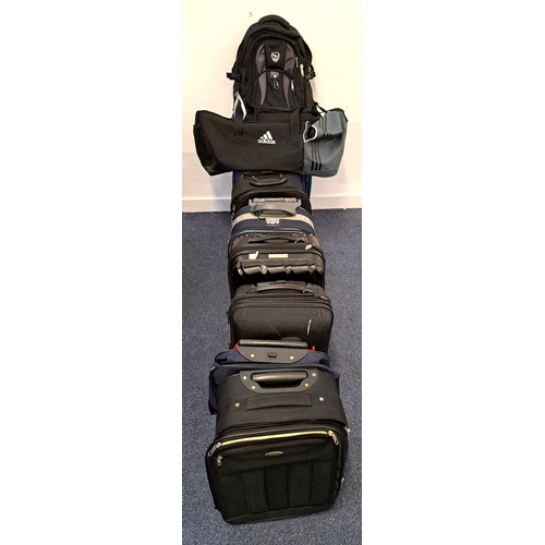 67 - SELECTION OF EIGHT SUITCASES , ONE HOLDALL AND ONE RUCKSACK
including Tripp, Swissdigital, Karst and... 