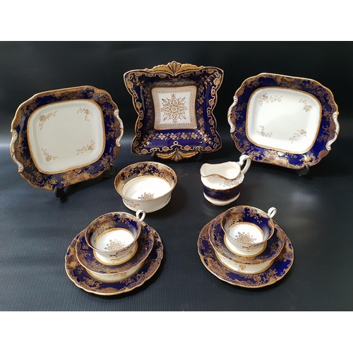 172 - AYNSLEY PORCELAIN TEA SERVICE
decorated in cobalt blue with gilt floral highlights, comprising ten t... 