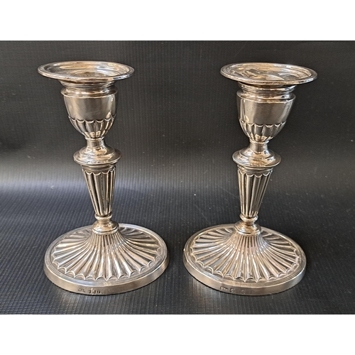 PAIR OF VICTORIAN SILVER CANDLESTICKS
in the Adam style, raised on oval bases, Glasgow 1896 by Muirhead and Arthur, 16.5cm high, loaded bases