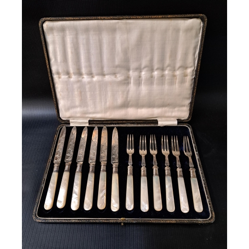 134 - SET OF SIX CASED EDWARD VII SILVER FRUIT KNIVES AND FORKS
with mother of pearl handles, Sheffield 19... 