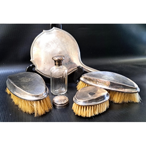 145 - VARIOUS SILVER DRESSING TABLE ACCESSORIES
1920s marks, comprising two brushes, hand mirror, silver t... 