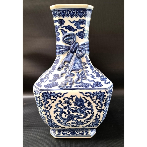 197 - CHINESE BLUE AND WHITE QIANLONG VASE
with profuse dragon, bat and foliate decoration overall and rel... 