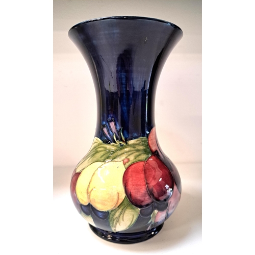 206 - MOORCROFT 'WISTERIA' PATTERN BALUSTER FORM VASE
on blue ground, stamped MOORCROFT and numbered 37, 1... 