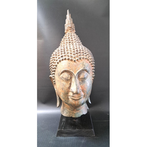 262 - BURMESE BRONZE BUDDHA HEAD
in the antique style, with elongated earlobes and curled headdress, mount... 