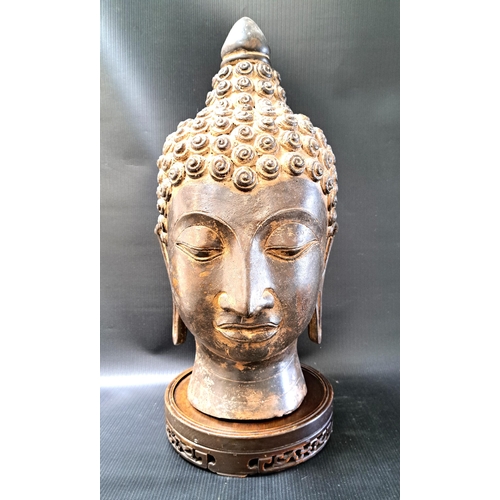 263 - LARGE BURMESE BRONZE BUDDHA HEAD
in the antique style, with elongated earlobes and curled headdress,... 